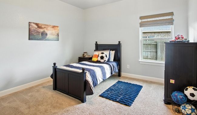Carpeted bedroom featuring baseboards | Image 22