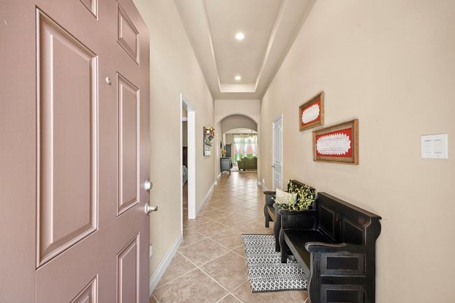 Expansive entry with high ceilings. | Image 4