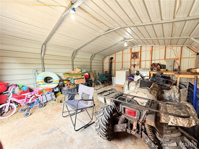 Garage featuring washer / dryer and metal wall | Image 67