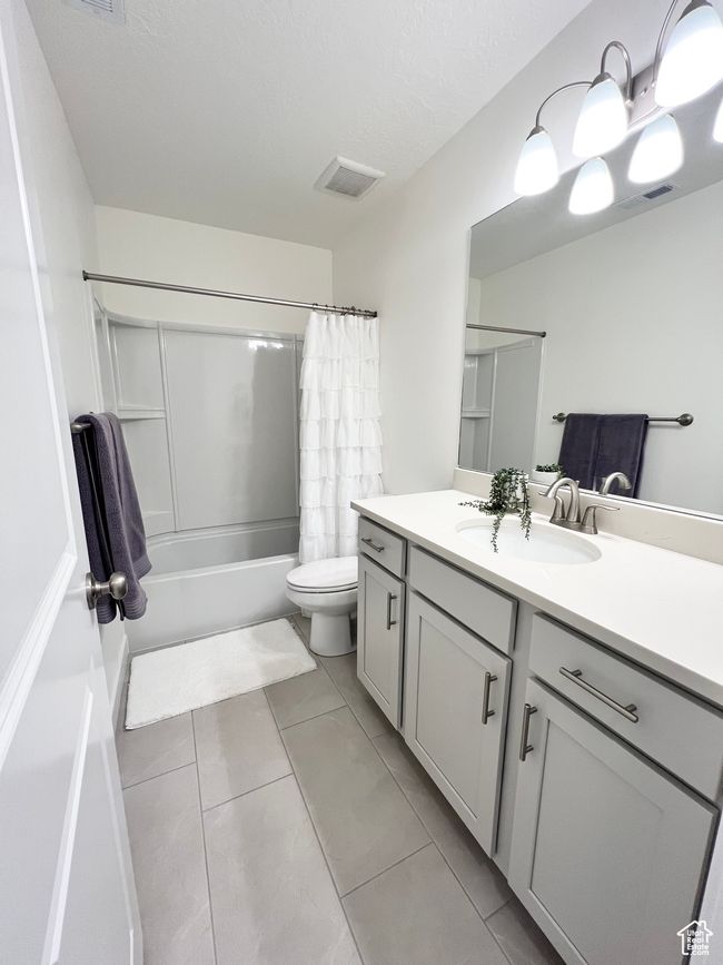 2nd full Bathroom featuring vanity, shower / tub combo with curtain, and tile patterned floors | Image 17