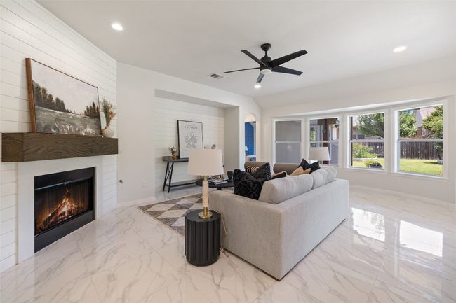 Living area w/fireplace, recessed lighting, and ceiling fan | Image 16