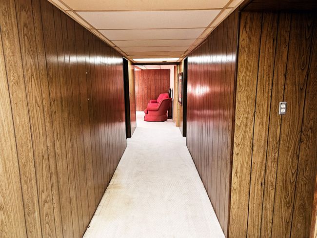 LOWER LEVEL HALL LEADING TO SITTING ROOM | Image 24
