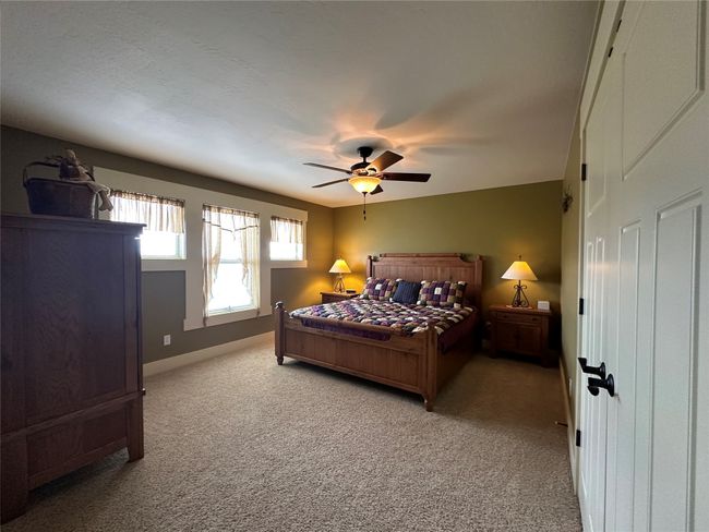 Bedroom featuring carpet and a ceiling fan | Image 15