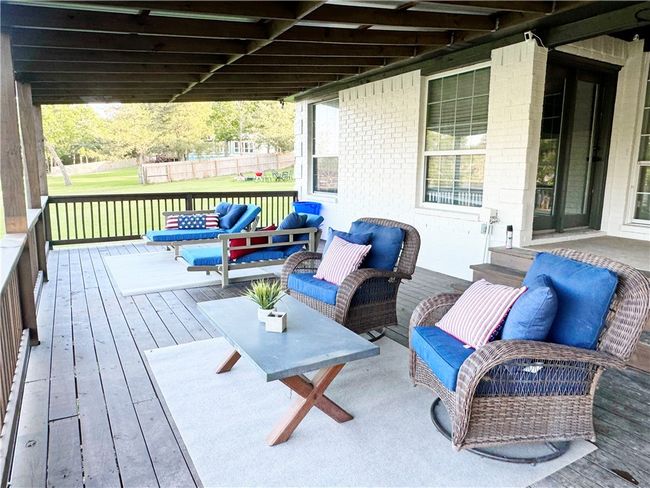 Wooden deck featuring outdoor lounge area | Image 24