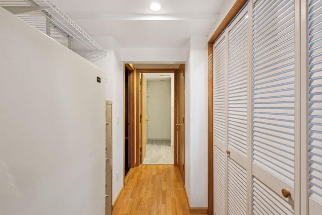 Lower level hall with storage closet and leads to 3/4 bath. | Image 28