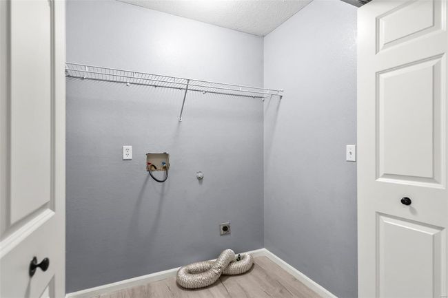 Spare room with a ceiling fan, visible vents, wood finished floors, and a healthy amount of sunlight | Image 19