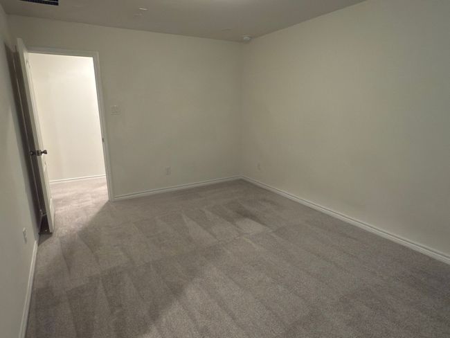 Unfurnished room featuring carpet flooring and baseboards | Image 8