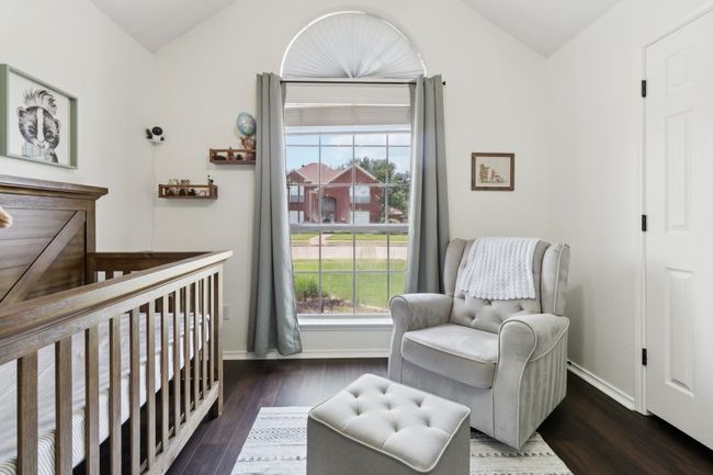 Bedroom featuring lofted ceiling, baseboards, and wood finished floors | Image 29