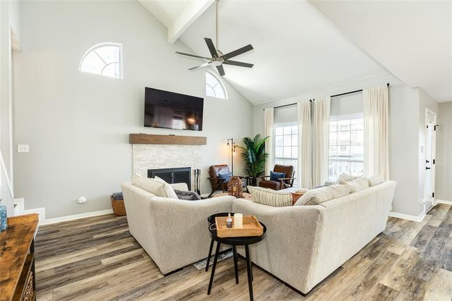 Living room is light & bright and has a vaulted ceiling | Image 8