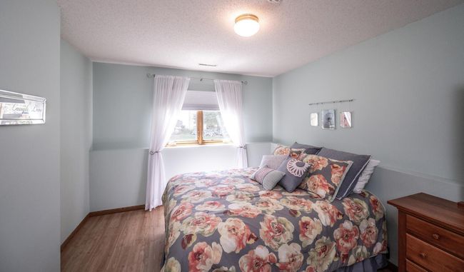 Lower level third bedroom with overhead lighting. | Image 30