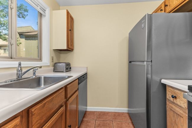 Kitchen with tile floors and new Refridgerator and Newer Dishwasher | Image 11