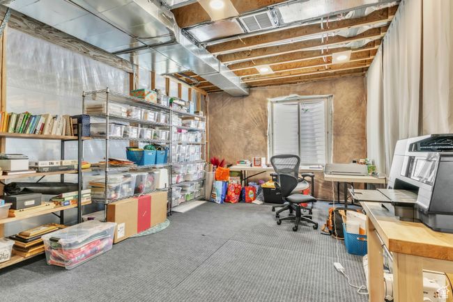 Below grade area with carpet floors and a desk | Image 28