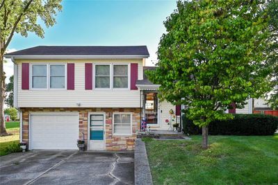 View of front of house with a front yard and a garage | Image 2