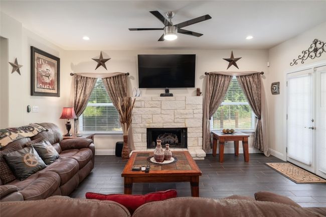A much needed fireplace, flanked with stones. | Image 12