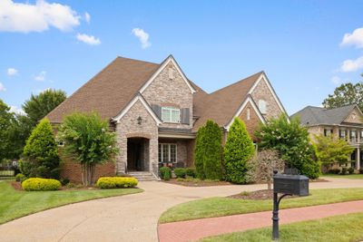 Gorgeous custom home! This home has so many upgrades and has an amazing open floor plan that is ideal for entertaining. The screened in porch is used year round and acts as an extension of the home. | Image 1