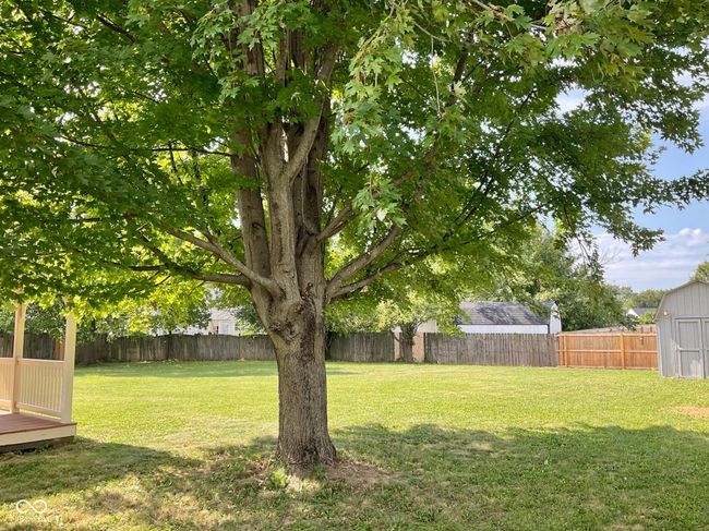 Back of home with massive fenced in private back yard. | Image 49