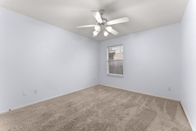 Unfurnished room featuring carpet floors, ceiling fan, and baseboards | Image 22