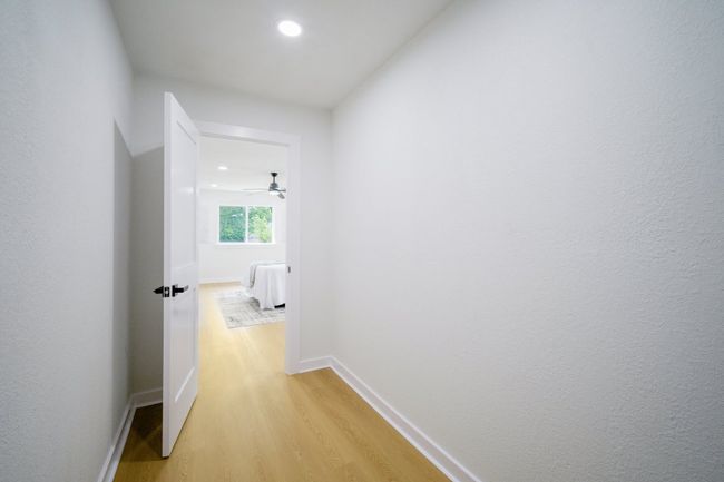 Hall featuring light wood-style flooring, recessed lighting, and baseboards | Image 20