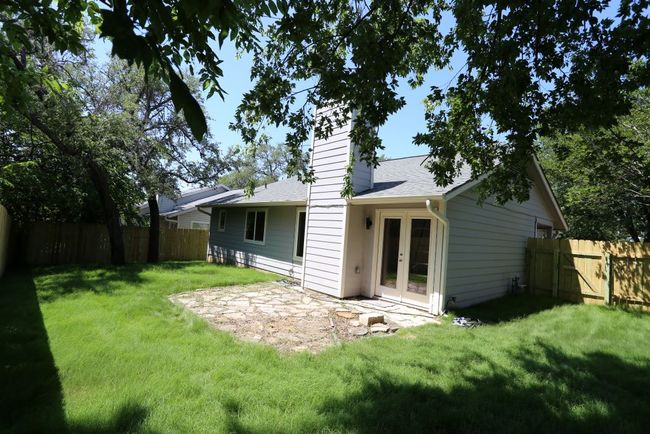 Spacious, private backyard features a new fence and sod. | Image 20