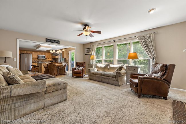 Living room with views out the back of the home | Image 12