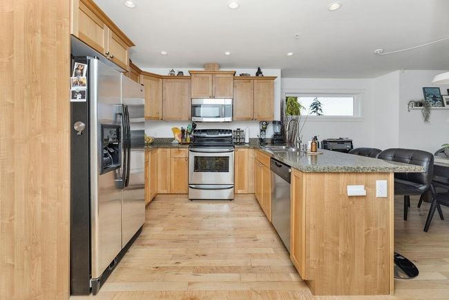 Kitchen with stainless steel appliances and granite countertops | Image 4