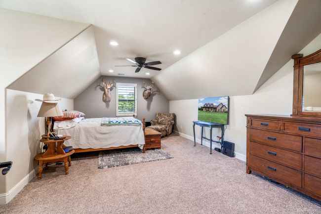 Bedroom with light colored carpet, ceiling fan, recessed lighting, and vaulted ceiling | Image 29