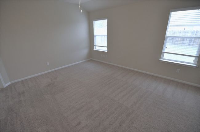 Unfurnished room featuring light colored carpet and baseboards | Image 16