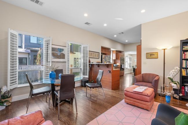 Dining space featuring visible vents, wood finished floors, and recessed lighting | Image 10