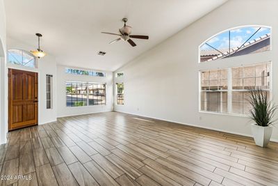 Bright Family Room with updated flooring and high ceilings. | Image 3