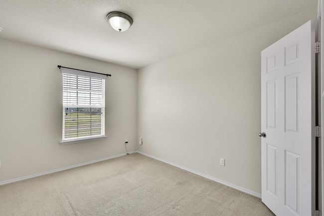 Unfurnished room with light carpet and baseboards | Image 19