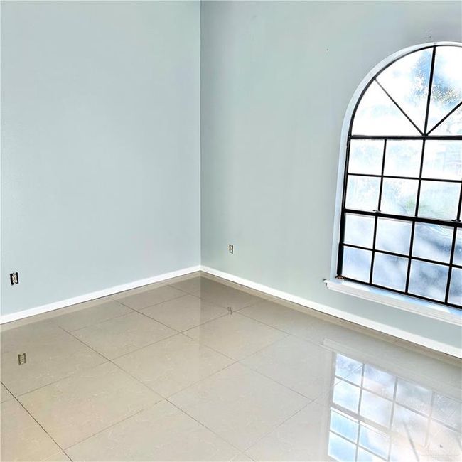 Tiled spare room featuring baseboards | Image 13