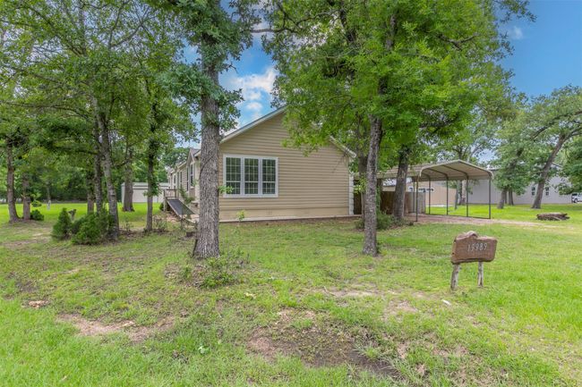 View of yard featuring a carport | Image 24
