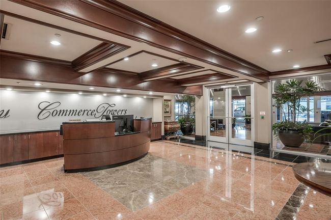 Commerce Towers Resident's Lobby is entered through secured access. All guests must check in with concierge to be announced and approved to go up to units. The lobby level also has mailroom & package area. | Image 9