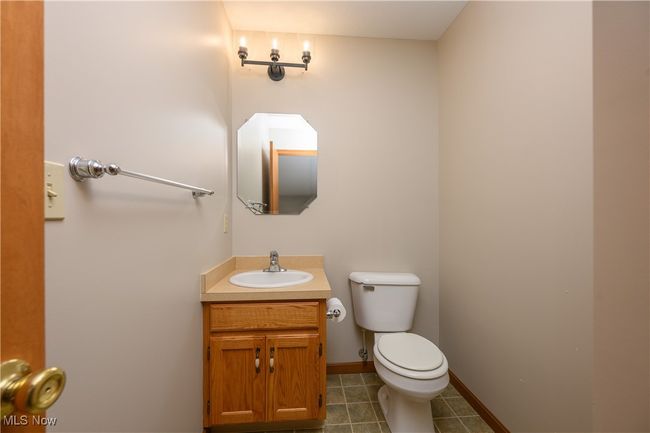 Bathroom with vanity and tile patterned flooring | Image 17