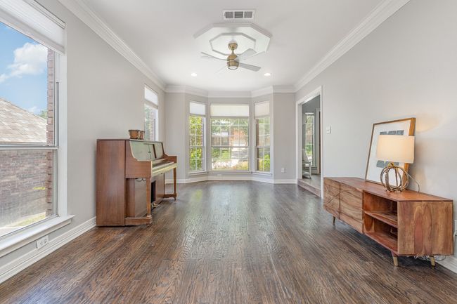 Living room with ceiling fan, hardwood floors, recessed lighting, ceiling fan and crown molding | Image 4