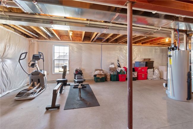 Large, dry space in the lower level-gravity drain and plumbed for another full bath! Make this a gym- studio- in-law or anything you choose! | Image 44