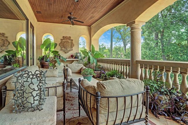 Wonderful upstairs backyard balcony. Located next to the game room and overlooks the pools and gardens. | Image 28