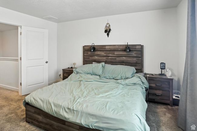 Primary Bedroom with carpet flooring and baseboards | Image 37