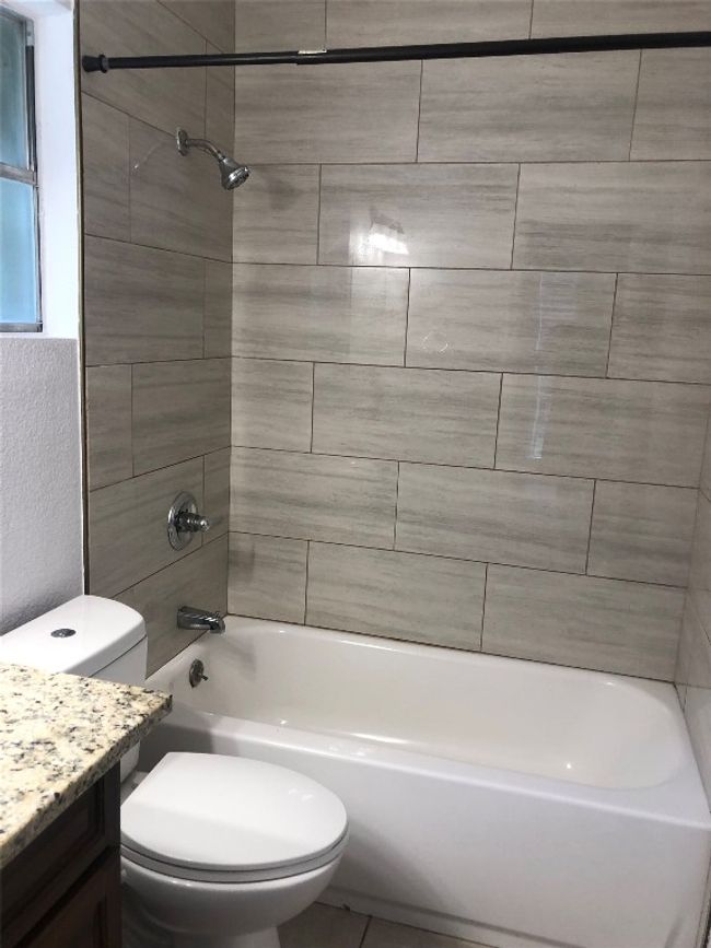 Bathroom with vanity and shower / bathtub combination | Image 14