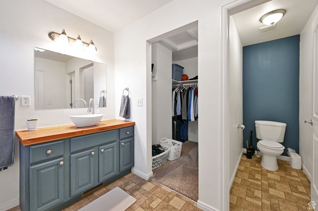 Bathroom featuring vanity and toilet | Image 17