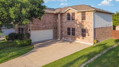 View of front of home with a front yard and a garage | Image 2