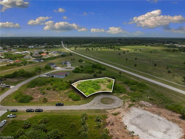 Aerial view of property and surrounding area with property parcel outlined and rural landscape | Image 8