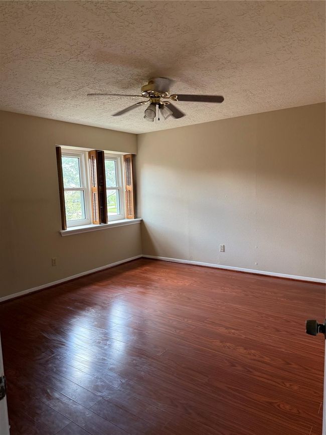 Large primary bedroom with two walk-in closets. | Image 25