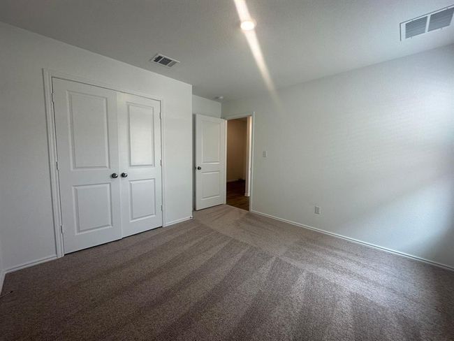 Unfurnished bedroom featuring carpet, a closet, and baseboards | Image 24