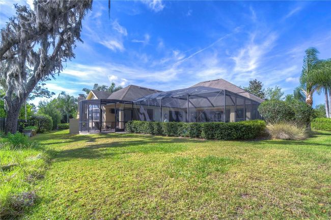 Enjoy a sprawling backyard retreat complete with lush landscaping | Image 39