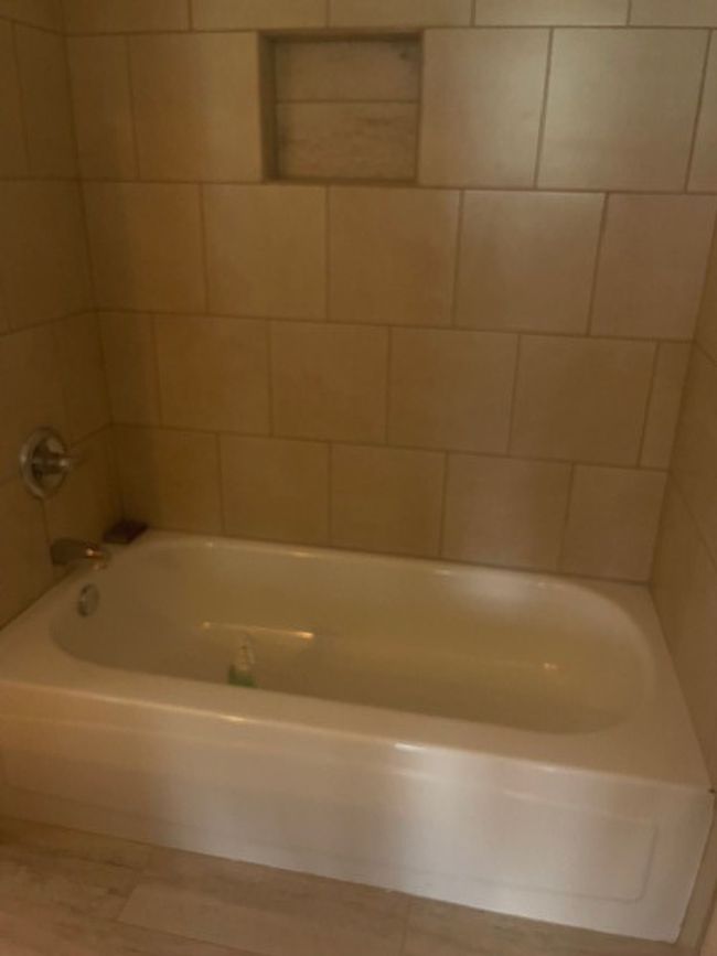 soaking tub with new tile surround. | Image 18