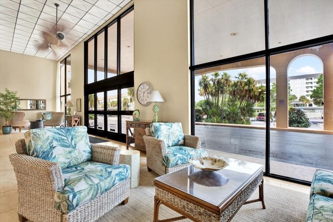 Interior entry with two elevators, mailboxes and club room on the main level | Image 6