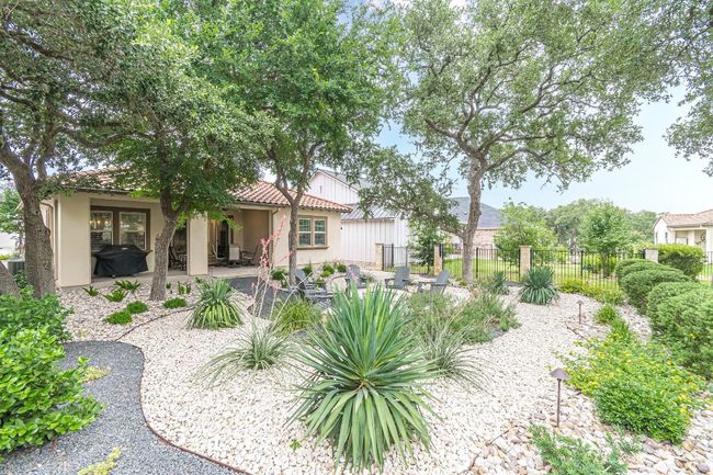 Back of house featuring a patio, stucco siding, and a tile roof | Image 35