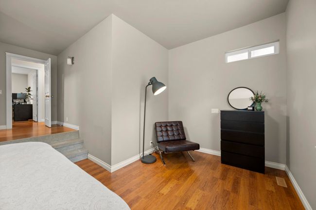 Bedroom featuring baseboards and wood finished floors | Image 21