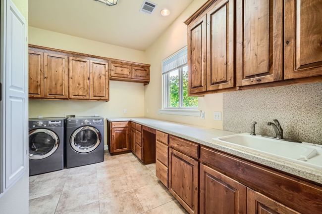 Expansive Laundry; w/ sufficient space for hobbies or crafts | Image 26